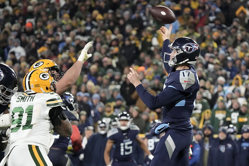 AP photo by Morry Gash / Tennessee Titans quarterback Ryan Tannehill passes under pressure from Green Bay Packers linebacker Preston Smith on Thursday night. The Titans won 27-17 to hand the host Packers their sixth loss in seven games.