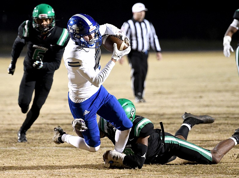 Staff photo by Robin Rudd / Red Bank's Logan McGinnis is brought down close to the goal line after making a catch during Friday night's game at East Hamilton. Red Bank won 28-6 to avenge a regular-season loss to its region rival and advance to the TSSAA Class 4A semifinals next week.