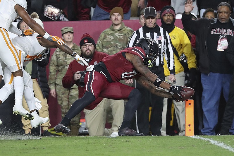 AP photo by Artie Walker Jr. / South Carolina tight end Jaheim Bell dives for the end zone to score on a 19-yard catch during the first half of Saturday night's game in Columbia, S.C.