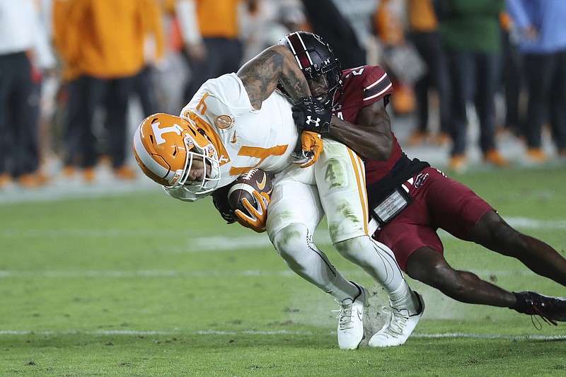 AP photo by Artie Walker Jr. / Tennessee wide receiver Cedric Tillman is tackled by South Carolina defensive back Marcellas Dial during the first half of Saturday's matchup of SEC East teams in Columbia, S.C.