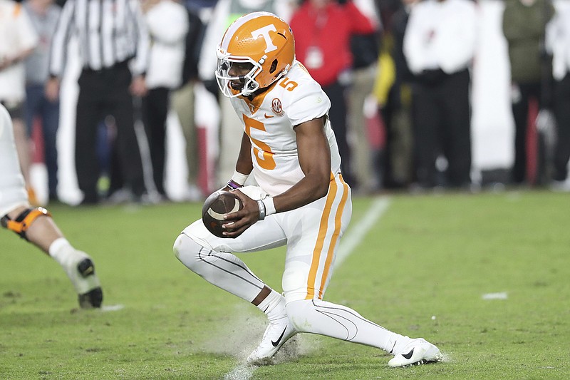 AP photo by Artie Walker Jr. / Tennessee quarterback Hendon Hooker injures his left knee while making a cut during the fourth quarter of Saturday night's game at South Carolina. On Sunday afternoon, the Vols said the sixth-year senior has a torn ACL, ending his season and his Tennessee career.
