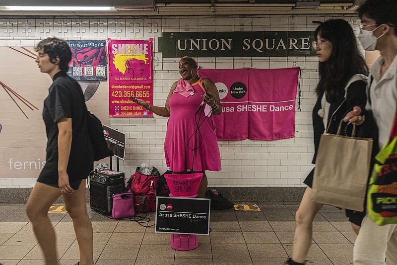 Azusa Dance performs inside the Union Square subway station in New York on Sept. 13, 2022. Dance, who sings as SheShe in Union Square, Herald Square and other subway stations, said that tips had gone down since the pandemic hit. / Hiroko Masuike/The New York Times