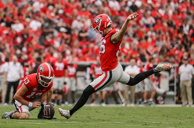 Georgia photo by Kayla Renie / Georgia fifth-year senior kicker Jack Podlesny, shown here with holder Stetson Bennett IV, has made 20-of-22 field-goal attempts this season for a 90.9% success rate.