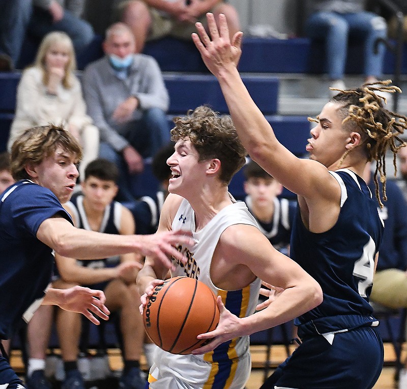 Staff Photo by Robin Rudd / Boyd Buchanan's Caden Johnson (1) is fouled as he drives to the basket.  The Boyd Buchanan Buccaneers hosted the Lakeway Christian Lions in TSSAA basketball on February 15, 2022.