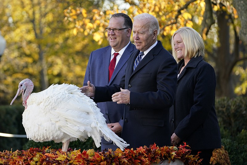 AP Photo/Susan Walsh / President Joe Biden, center, pardons Peanut Butter, the national Thanksgiving turkey, in the Rose Garden of the White House in Washington, D.C.,on Friday, Nov. 19, 2021.