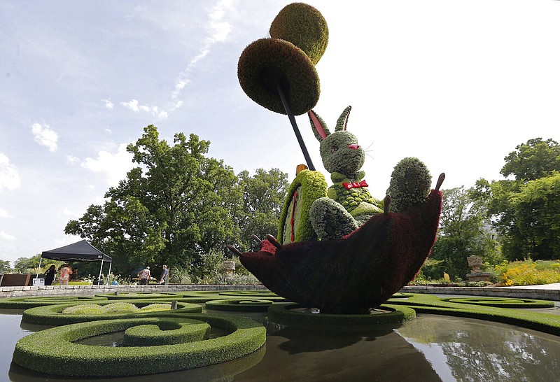 In this photo taken Monday, July 15, 2019, the Atlanta Botanical Garden features the Imaginary Worlds: Alice's Wonderland exhibit May 11-Oct. 27. (AP Photo/Andrea Smith)