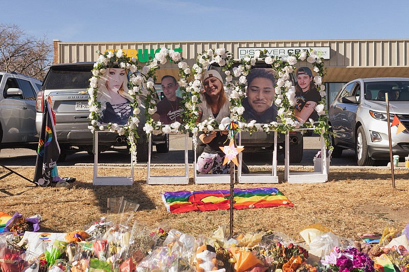 Photo/Joanna Kulesza/The New York Times / A makeshift memorial stands in front of Club Q, where a mass shooting on Nov. 19, 2022, left five people dead and 18 people injured in Colorado Springs, Colo.