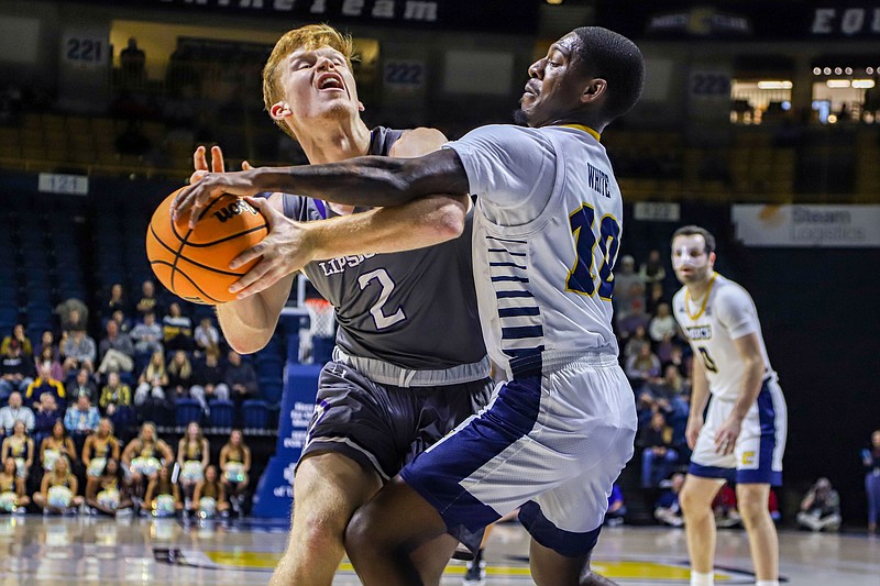 Staff photo by Olivia Ross / UTC’s Dalvin White (10) guards Lipscomb’s Will Pruitt (2). The UTC Mocs took on Lipscomb at home on Wednesday, Nov. 23, 2022.