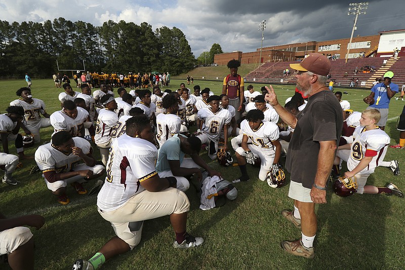 Staff File Photo / Former Tyner coach Wayne Turner speaks to his team in 2016. Turner will be among those honored as Tyner plays its last home game Friday on the field that bears his name.