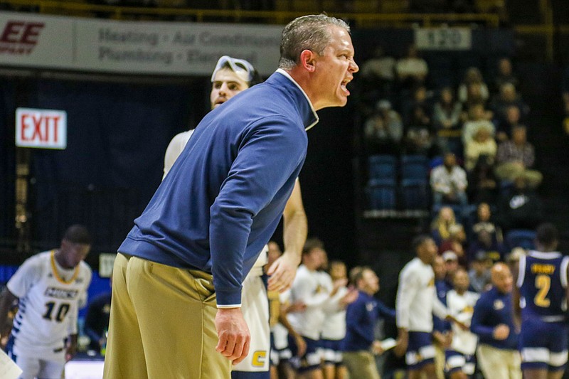 Staff photo by Olivia Ross / UTC's men's basketball coach Dan Earl yells from the sideline during Saturday's home win against Murray State.