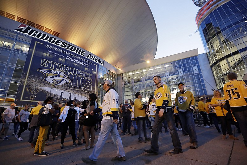 AP photo by Mark Humphrey / Fans arrive at Bridgestone Arena for a Stanley Cup playoff game between the Dallas Stars and the host Nashville Predators in April 2019. The Predators have postponed back-to-back home games Friday and Saturday due to a water main break that the NHL said “significantly impacted the event level” of the downtown venue.