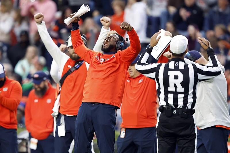 AP photo by Butch Dill / Auburn interim football coach Carnell "Cadillac" Williams reacts as referee Scott Walker signals a touchdown during the first half of the Tigers' home win against Western Kentucky last Saturday.