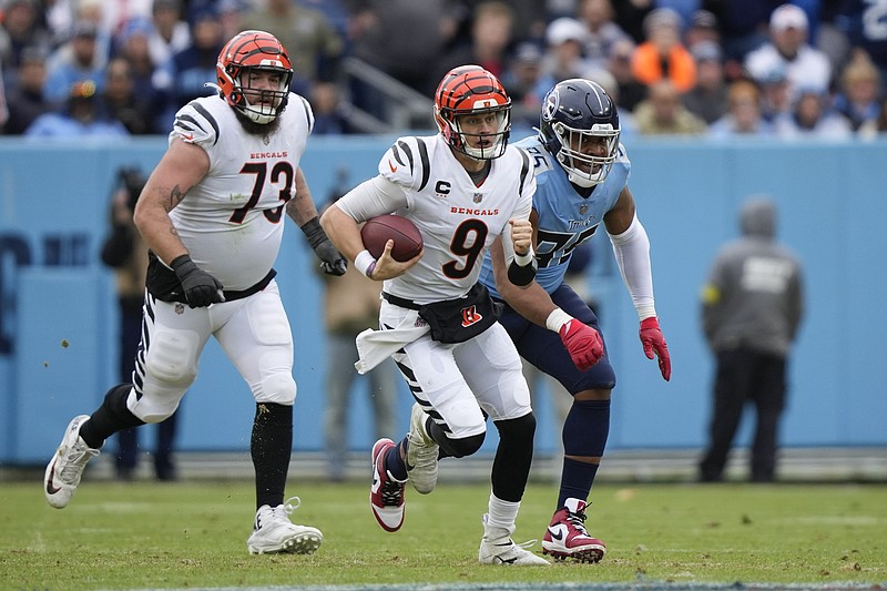 AP photo by Gerald Herbert / Cincinnati Bengals quarterback Joe Burrow (9) runs out of the pocket during Sunday's game against the Tennessee Titans in Nashville.