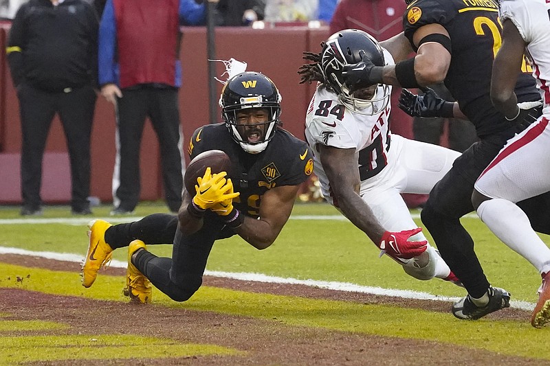 AP photo by Alex Brandon / Washington Commanders cornerback Kendall Fuller picks off Marcus Mariota's pass as Atlanta Falcons running back Cordarrelle Patterson (84) is unable to get to the ball late in Sunday's game.