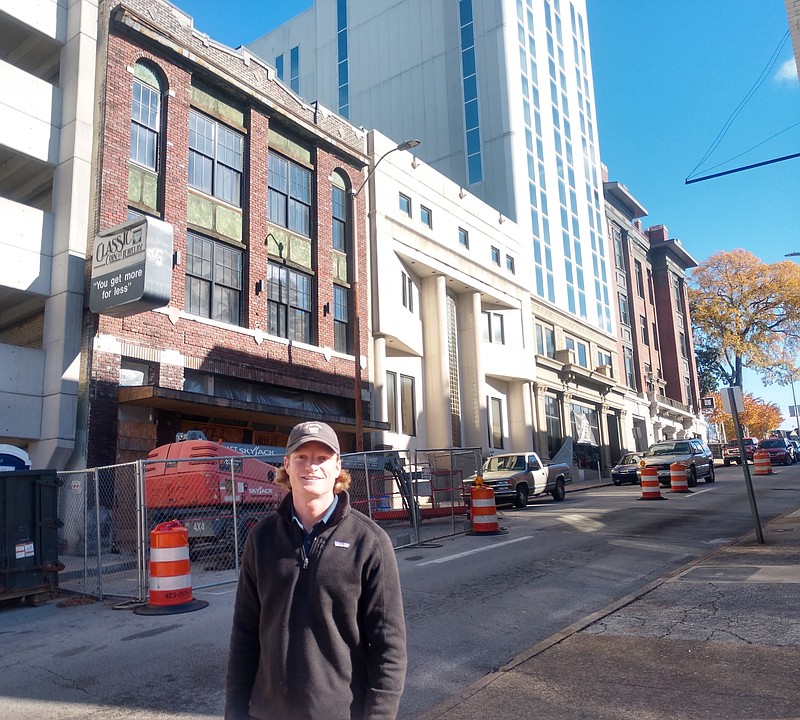 Staff photo by Mike Pare / Developer Lawrence Dossche stands on Seventh Street in downtown Chattanooga in front of the historic brick Classic Coin building on Monday. Dossche is spending about $3 million to restore the structure.