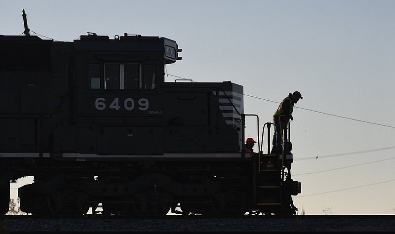 Staff Photo by Robin Rudd / In the early morning a Norfolk Southern crew, using a SD40-3 locomotive, to switch freight cars at the Archer Daniel Midland Mill on November 23, 2022.