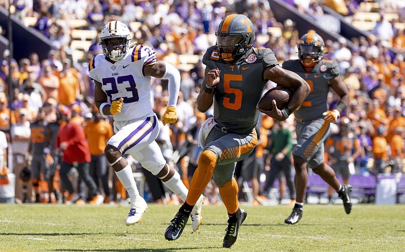 Tennessee Athletics photo by Avery Bane / LSU linebacker Micah Baskerville gives chase to Tennessee quarterback Hendon Hooker during the 40-13 win by the Volunteers inside Tiger Stadium on Oct. 8.