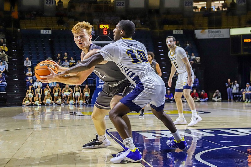 Staff photo by Olivia Ross / UTC's Dalvin White (10) guards Lipscomb's Will Pruitt during a Nov. 23 game at McKenzie Arena. Defense was a big factor for White and the Mocs in Wednesday night's win at Tennessee Tech.