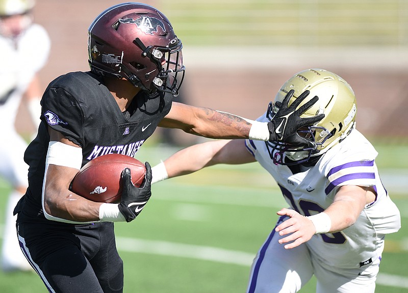 Staff photo by Matt Hamilton / Lipscomb Academy's Maureice Sherrill Jr. stiff-arms a CPA defender on his way to a 41-yard touchdown catch during the TSSAA Division II-AA BlueCross Bowl on Thursday at Finley Stadium. Sherrill was named MVP of the game after leading the Mustangs to their second straight state title.