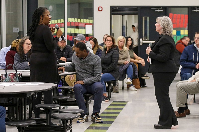 Staff Photo by Olivia Ross  / Monique Scott, an East Hamilton Middle School parent, speaks to Principal Kristen Childs. Parents gathered Thursday for a meeting with administrators at East Hamilton Middle School to discuss student behavior, an increase in violence at the school and other issues.