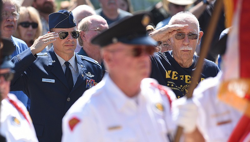 Staff Photo by Matt Hamilton / Retired Air Force Lt. Col. Joel Dopson, left, and U.S. Navy veteran Charles Wheaton, both of Ooltewah, salute May 30 as the colors are presented during a Memorial Day program at the Chattanooga National Cemetery.