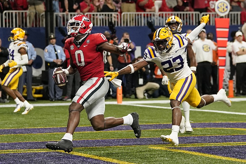 AP photo by Brynn Anderson / Georgia tight end Darnell Washington scores on a 14-yard touchdown pass to push the Bulldogs' lead over LSU to 28-7 late in the first half of the SEC title game Saturday at Atlanta's Mercedes-Benz Stadium.