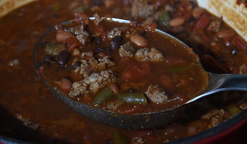 Staff file photo / There's nothing like a good pot of chili to warm you up after a day of hunting at deer camp, where bringing the wrong food can lead to days of debate.