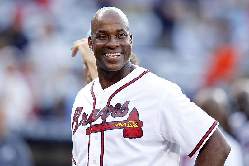 AP photo by Brett Davis / Former Atlanta Braves first baseman Fred McGriff smiles on the field before a  game against the Miami Marlins in August 2015.