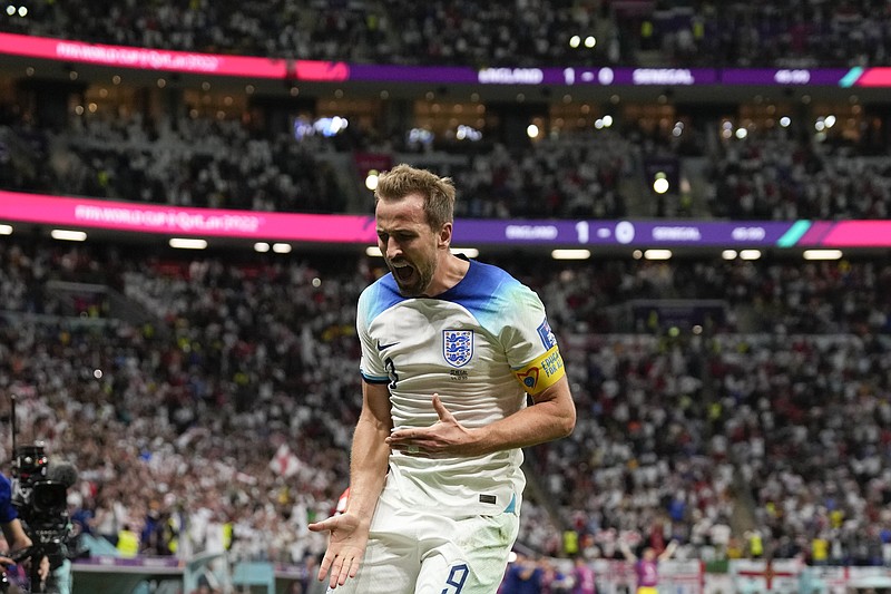 AP photo by Frank Augstein / England's Harry Kane celebrates after scoring his team's second goal during a 3-0 win against Senegal in a World Cup round of 16 match Sunday at Al Bayt Stadium in Al Khor, Qatar.