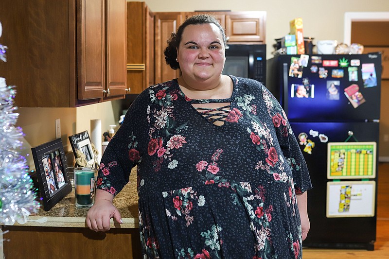 Staff photo by Olivia Ross  / Erika Taylor, who received help from the Neediest Cases fund, stands in her home on Tuesday.