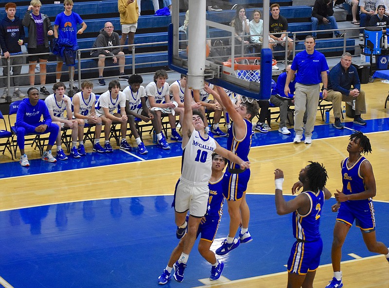 Staff photo by Patrick MacCoon / McCallie junior point guard Parker Robison scores the game-winning basket in the final seconds of Tuesday's home win over Boyd Buchanan.
