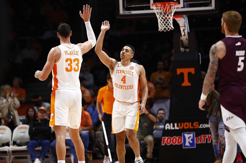 Tennessee Athletics photo / Tennessee senior forward Uros Plavsic and senior guard Tyreke Key celebrate during Wednesday night’s 84-49 blowout of Eastern Kentucky. Key and Plavsic combined for 30 points.