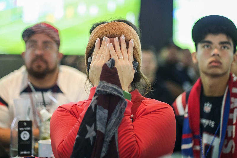 AP photo by H.W. Chiu / U.S. soccer fan Karla Rosales covers her face at a watch party in Los Angeles during the Americans' 3-1 loss to the Netherlands this past Saturday in an elimination match at the World Cup in Qatar.
