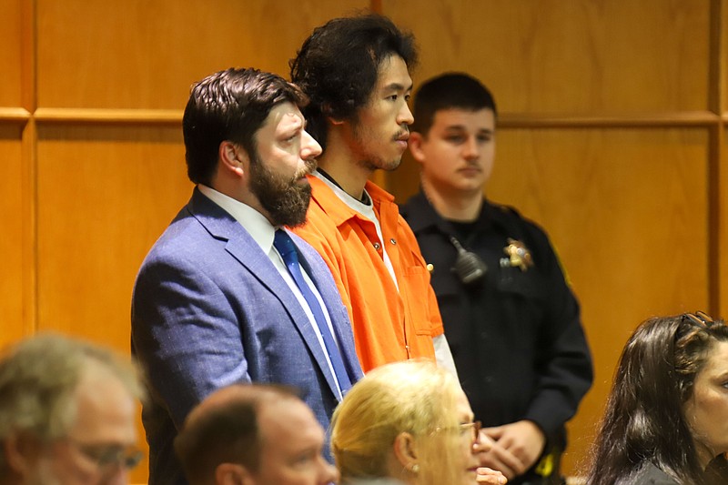 Staff photo by Olivia Ross  / Jason Chen stands with his attorney Josh Weiss in court Tuesday.