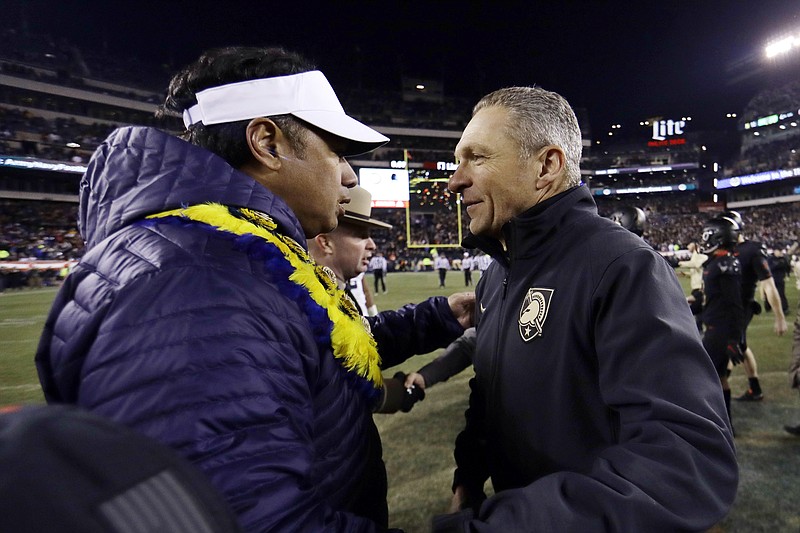 AP file photo by Matt Slocum / Navy football coach Ken Niumatalolo, left, and Army counterpart Jeff Monken will meet again Saturday in Philadelphia as the Midshipmen and Black Knights renew their rivalry for the 123rd time. Each team has a losing record going into the finale, but in both cases, a victory would change the complexion of the season.