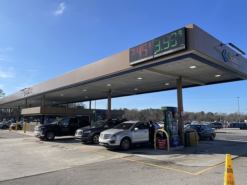 Photo by Dave Flessner / Motorists refuel their vehicles at the Sam's Club where regular gasoline was priced Monday at $2.45 a gallon — the lowest in the Chattanooga market. Gas prices in Chattanooga dropped an average of 14 cents a gallon in the past week to their lowest level in 16 months.