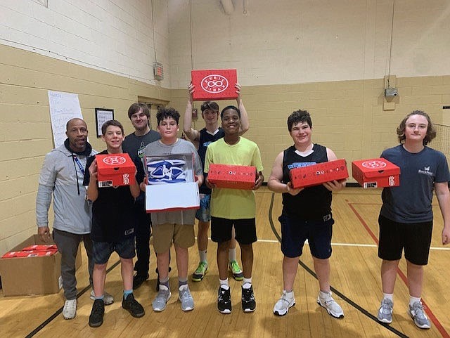 Contributed photo/ Students at Skyuka Hall who play basketball recently were given new athletic shoes by Shirley Krause, the widow of the late Dr. Richard Krause.