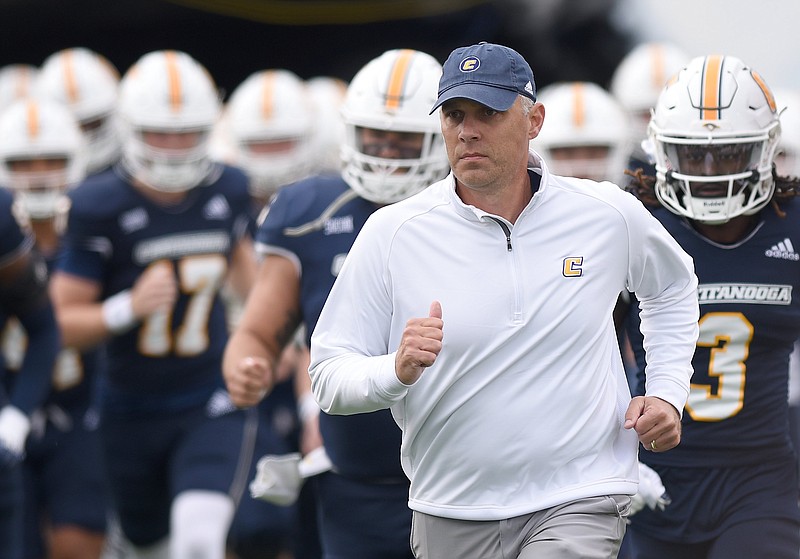 Staff photo by Matt Hamilton / UTC head coach Rusty Wright takes the field with his players at Finley Stadium on Saturday, November 12, 2022.