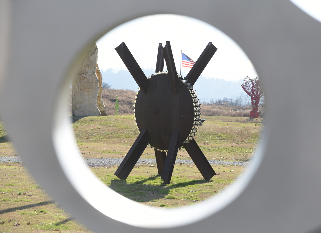 Staff photo by Matt Hamilton / A sculpture viewed through a sculpture titled "Composer" at Montague Park on Wednesday, Dec. 21.