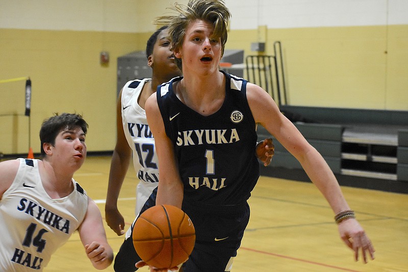 Staff photo by Patrick MacCoon / Skyuka Hall sophomore Logan Smith drives to the hoop for a layup attempt in practice.