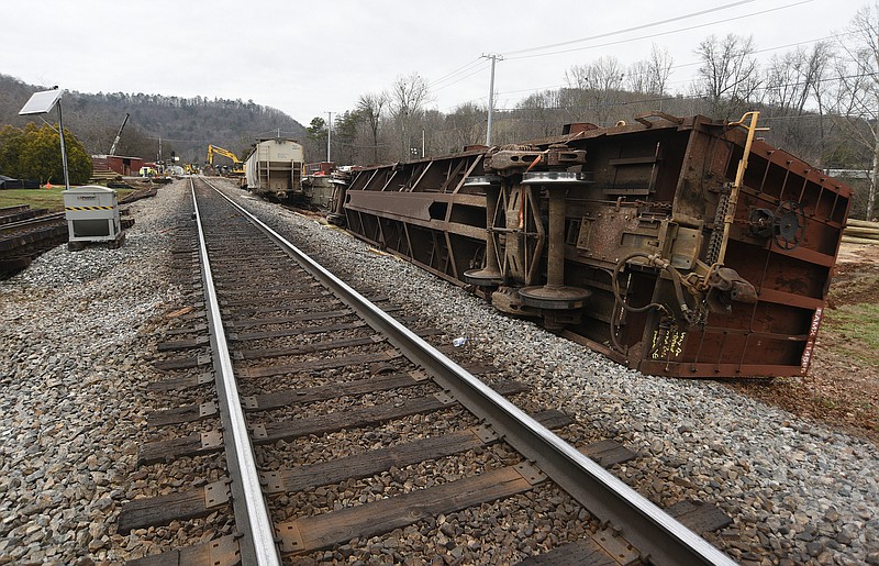 Staff photo by Matt Hamilton / Overturned train cars rest along the tracks at the site of the train derailment at the intersection of the tracks with Apison Pike on Wednesday.