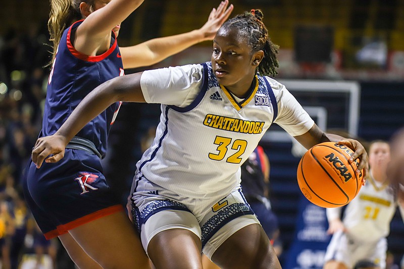 Staff file photo by Olivia Ross  / UTC's Raven Thompson (32) scored 23 points and had six rebounds in a narrow loss at Marshall Wednesday.