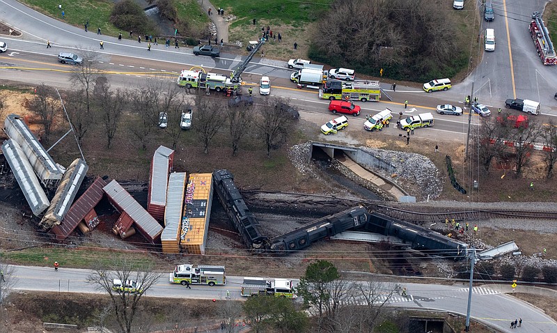 Todd Pettibone/ Aviation Specialists Inc. / A detail of the scene of a Norfolk Southern Railway train derailment in Collegedale, Tenn., on Tuesday shows the 134-foot-long concrete bridge beam lying beneath some of the train's locomotives.