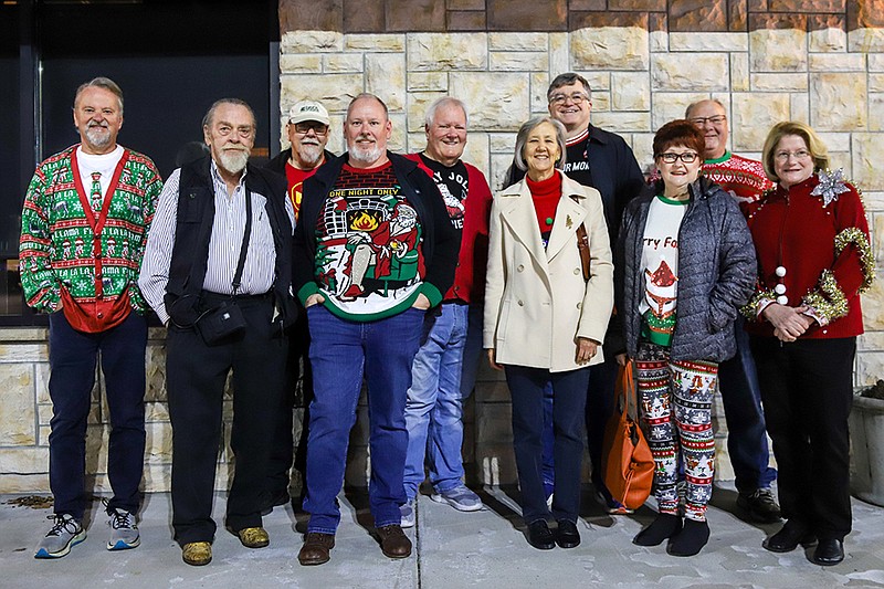 Staff photo by Olivia Ross  / Members of the Chattanooga Mensa Society pose for a group photo at a Christmas dinner.