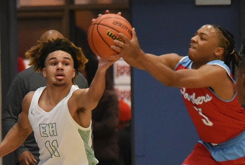 Staff photo by Matt Hamilton / Brainerd's Dennis Lewis Jr., right, and East Hamilton's Ashton Munson battle for the basketball during a Best of Preps tournament first-round matchup Wednesday at Chattanooga State.