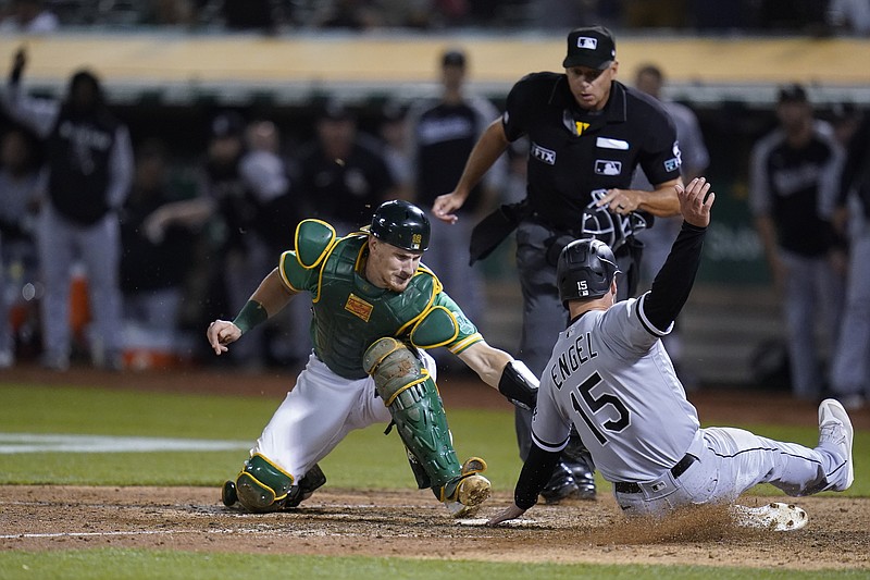 AP photo by Godofredo A. Vásquez / Oakland Athletics catcher Sean Murphy tries to tag Adam Engel as he scores for the Chicago White Sox during the ninth inning of a Sept. 9 game in California. Murphy joined the Atlanta Braves this month in a three-team trade involving the Milwaukee Brewers, and this week he signed a six-year contract for $73 million with Atlanta.