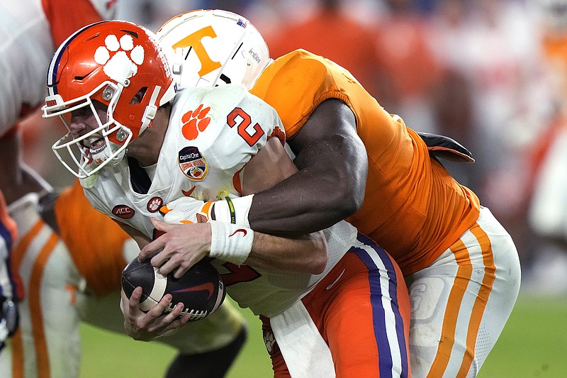 AP photo by Lynne Sladky / Clemson quarterback Cade Klubnik is tackled by Tennessee defensive lineman Byron Young during the second half of the Orange Bowl on Friday night in Miami Gardens, Fla.