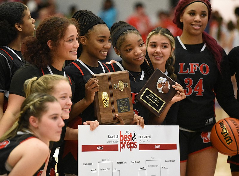 Staff photo by Matt Hamilton / Members of the LFO girls' basketball team pose for pictures after winning the Best of Preps tournament Friday night at Chattanooga State.