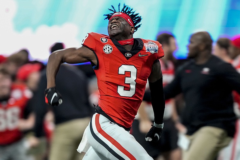 AP photo by John Bazemore / Georgia running back Andrew Paul celebrates after the Bulldogs held on to beat Ohio State in a College Football Playoff semifinal at the Peach Bowl on Saturday night.