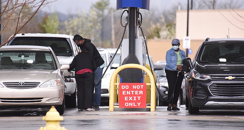 Staff Photo by Matt Hamilton / Motorists pump gas at the Sam's Club Fuel Center on Lee Highway on March 7 in Chattanooga.